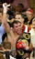 Oscar De La Hoya of Los Angeles, is consoled by his wife Millie after being knocked out be Bernard Hopkins Saturday, Sept. 18, 2004, at the MGM Grand